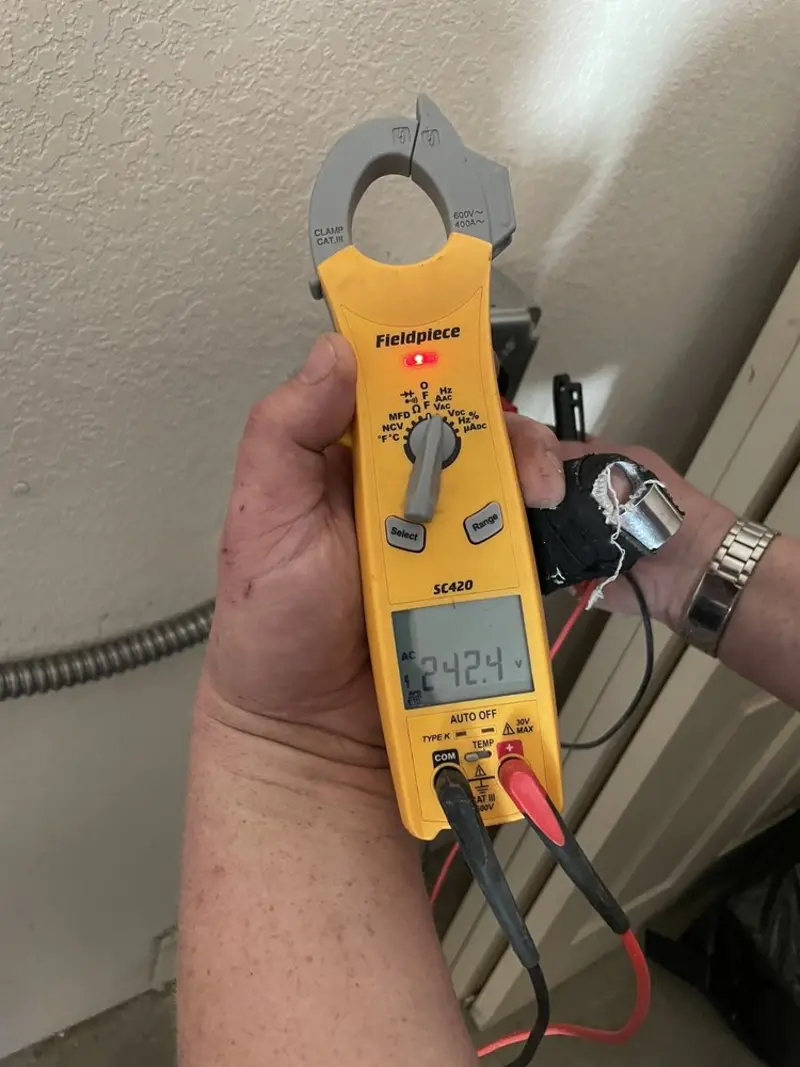 Voltage testing with clamp meter during Electrical Installation Services in Randleman